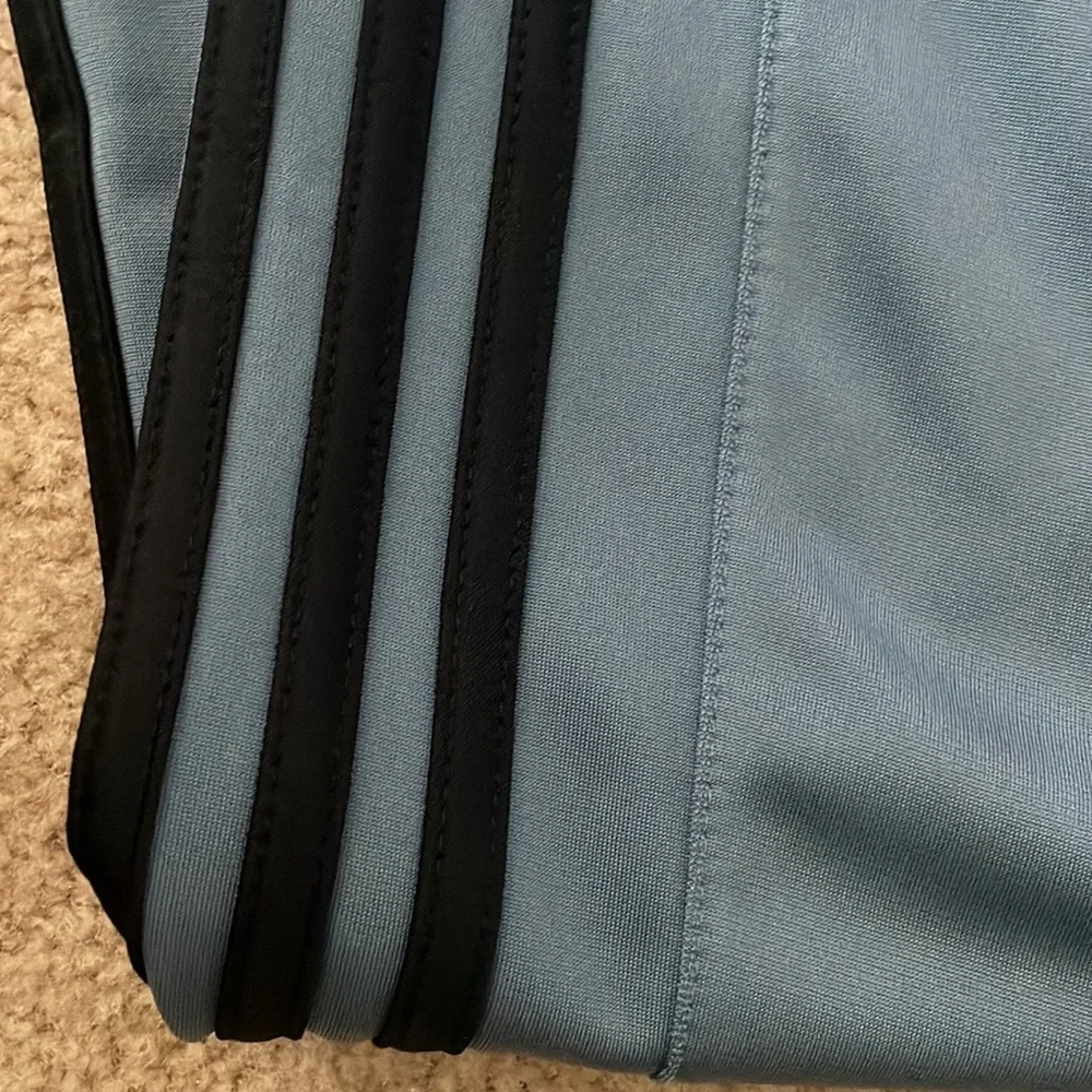 Adidas Men’s Joggers. Blue/grey color with black stripes.